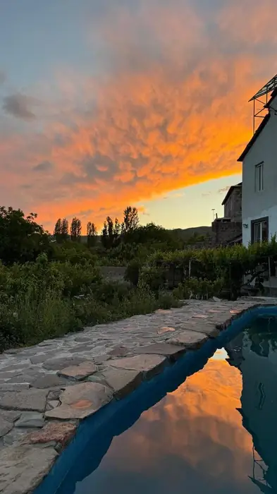 The pool at sunset, orange cloud reflected in the water