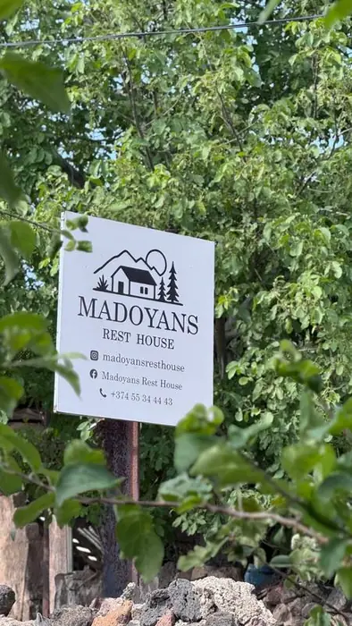 The Madoyans Rest House sign at the gate